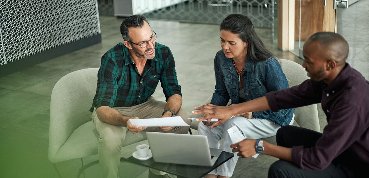 A diverse couple working with an advisor.