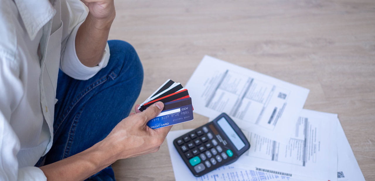 Business men sitting stressed out with home expenses and monthly credit card debt.